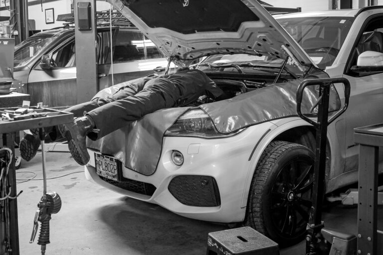 Technician working under the hood